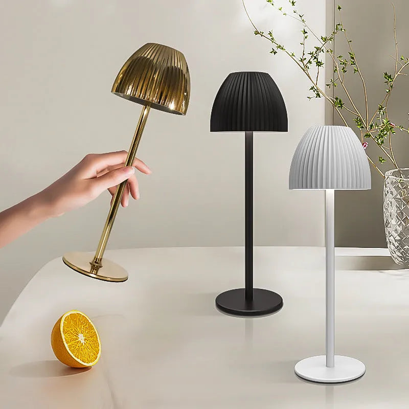 Modern dimmable USB rechargeable night lamp with thin round base in black or white colour.