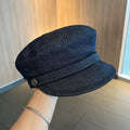 Dark blue denim newsboy hat with adjustable sizing and optional contrasting brim colours