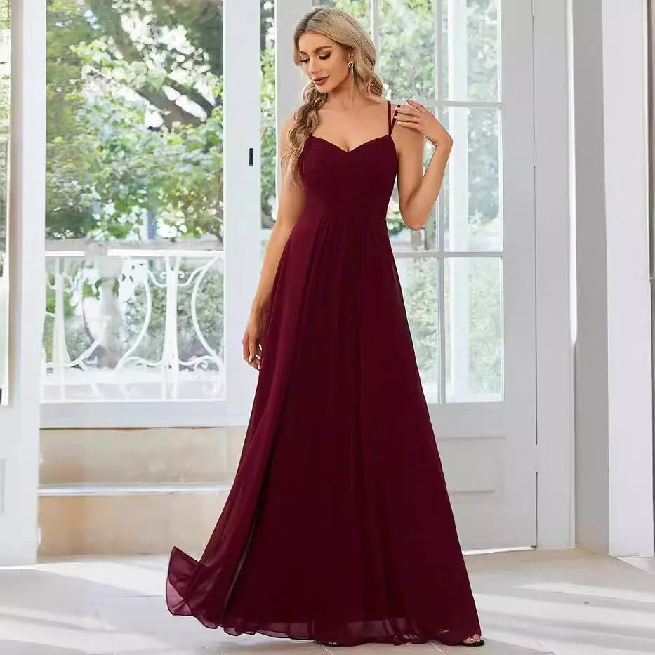 Women's long sling banquet dress with pleating detail in A-line silhouette, available in multiple colours