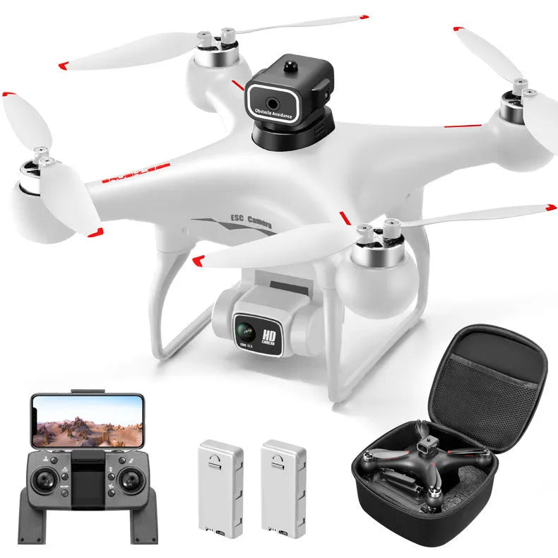 Black plastic UAV drone with four propellers and camera, remote control transmitter beside it