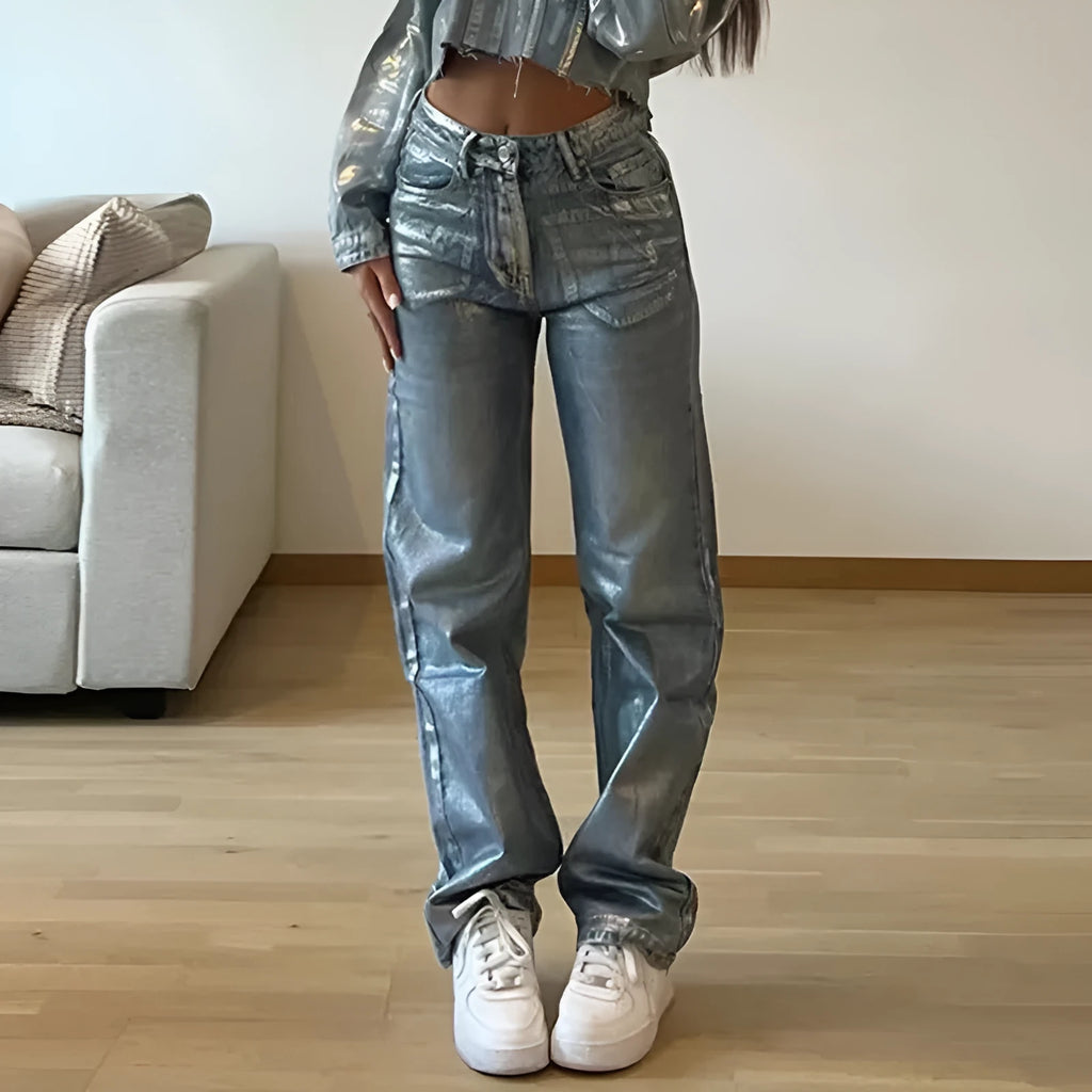Washed blue high waist straight leg women's jeans on a neutral background.