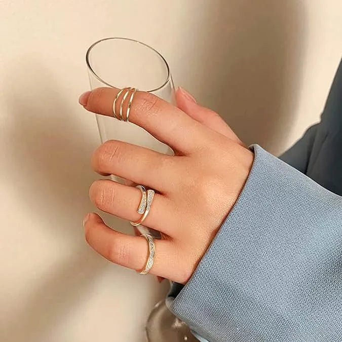 Geometric gold plated toe ring with rhinestone or water drop decoration on an alloy band.