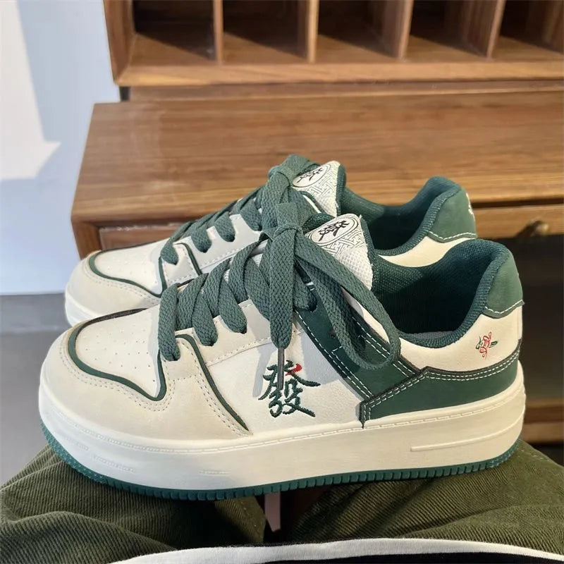 Men's retro low-top sneakers with synthetic PU upper, rubber sole, and colour blocking in green, pink, white, or white black.