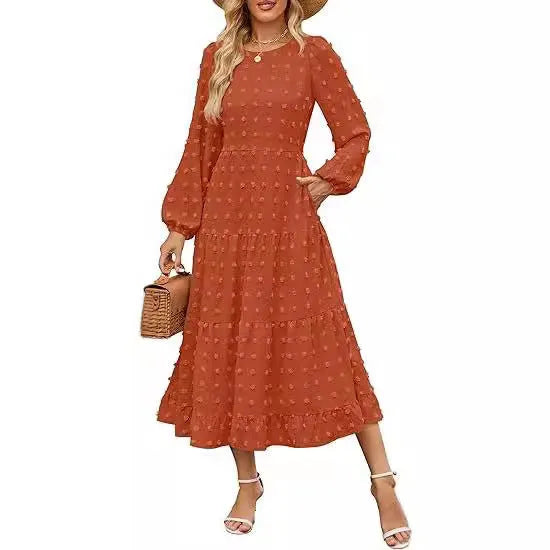 Women's long sleeve autumn dress with ruffle sleeves and high waist in a solid colour.