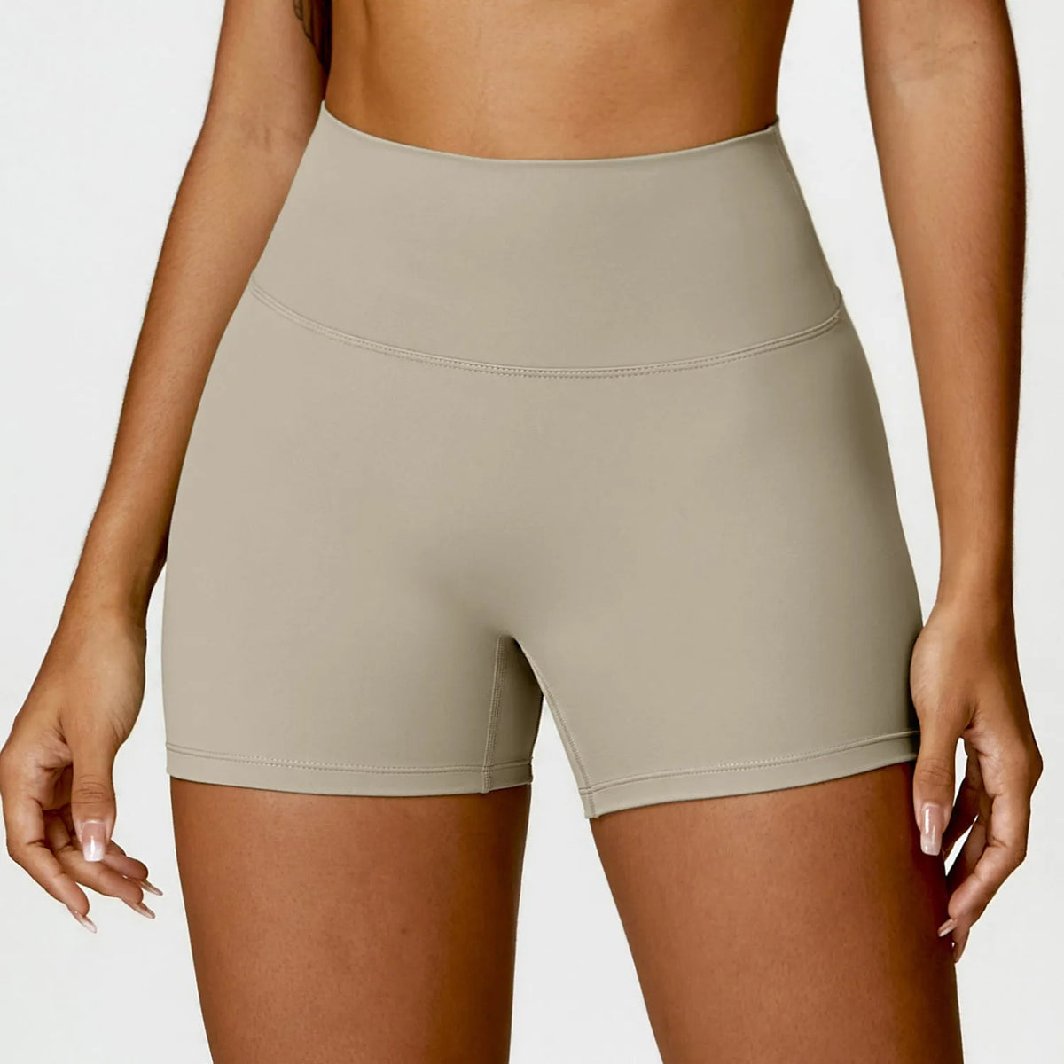 Women's high waist yoga shorts with compression panel and peach-shaped hip cut
