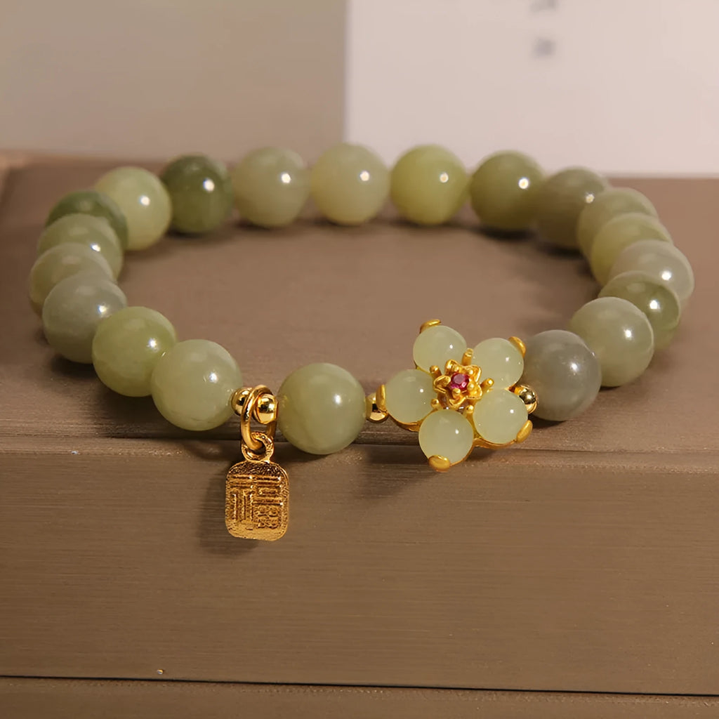 A grey jade coloured alloy bracelet for women in a casual style.