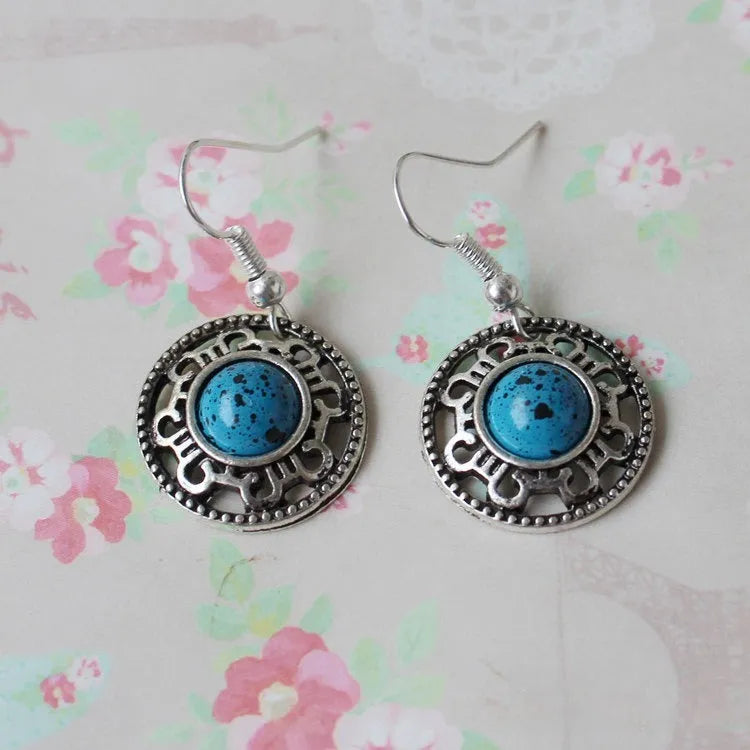 Handmade geometric Miao silver earrings with turquoise stones and ethnic patterns in three colour options