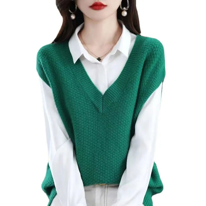 Creamy-white sleeveless knitted vest with a 3D raised pattern, V-neck, and pullover design.