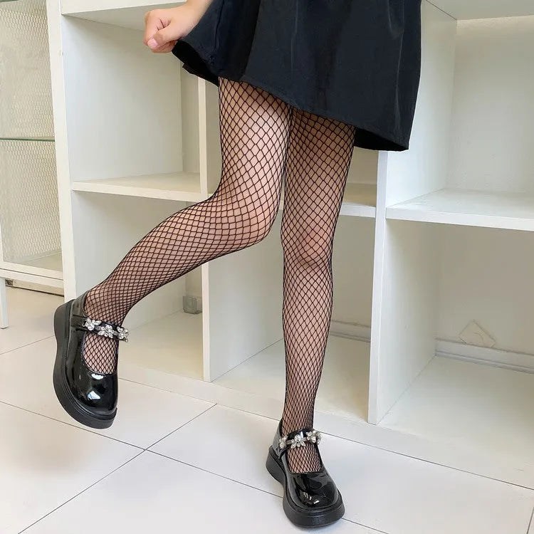 Women's mesh stockings showing large, medium and small patterns in black and white colours