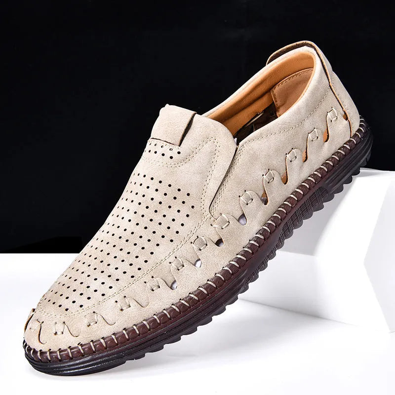 Men's brown leather slip-on casual shoes with flat sole, round toe, and decorative stitching.