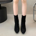 Brown women's square toe ankle boots with side zip and stiletto heel on a waterproof platform sole