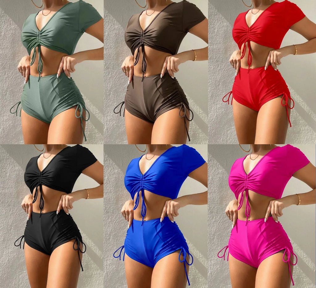 Women's two-piece swimsuit with lace-up front top and matching shorts in polyester material.