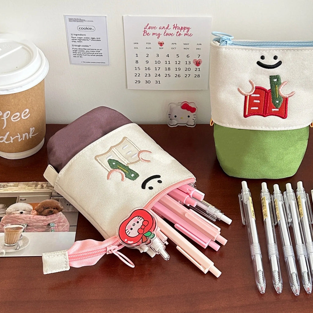 Brown Korean style cartoon pattern collapsible pencil case with zip closure showing 17cm by 14cm dimensions