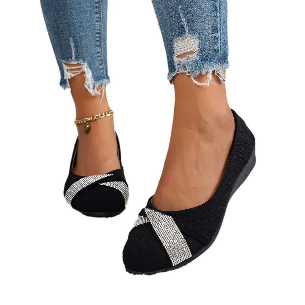 Women's black casual slip-on shoes with rhinestone details on fabric upper and chunky heel