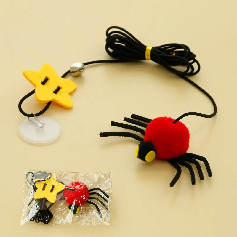 Hanging cat toy with feathers, bell and colourful spiders on elastic rope