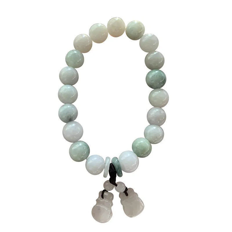 Natural emerald jade bracelet with hanging geometric beads and Buddhist elements