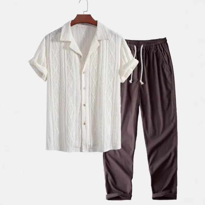 Men's slim fit camouflage print linen-style suit with short sleeve shirt and trousers on a hanger.
