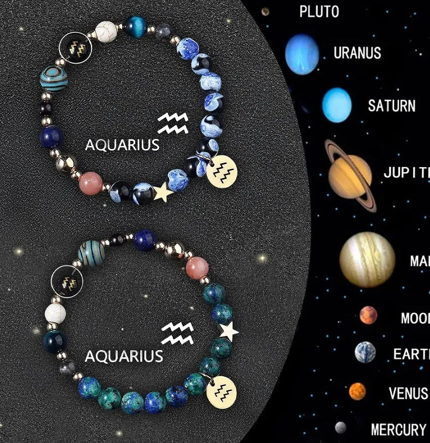 Set of two natural stone beaded bracelets featuring different zodiac sign designs on a wrist.