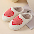 Adult women's plush cartoon-style home slippers with non-slip PVC soles in multiple colour options.