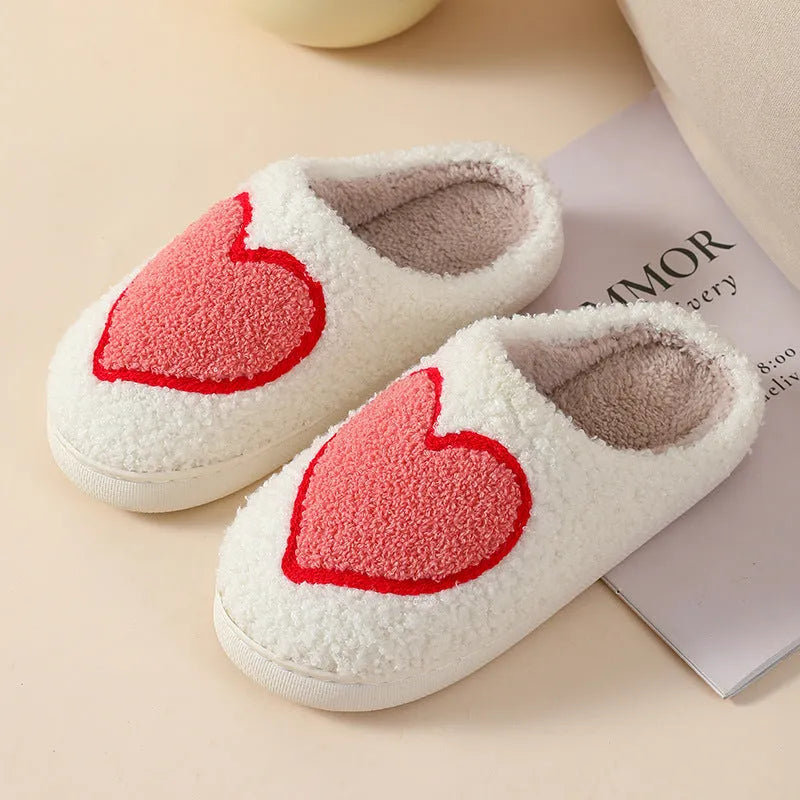Adult women's plush cartoon-style home slippers with non-slip PVC soles in multiple colour options.