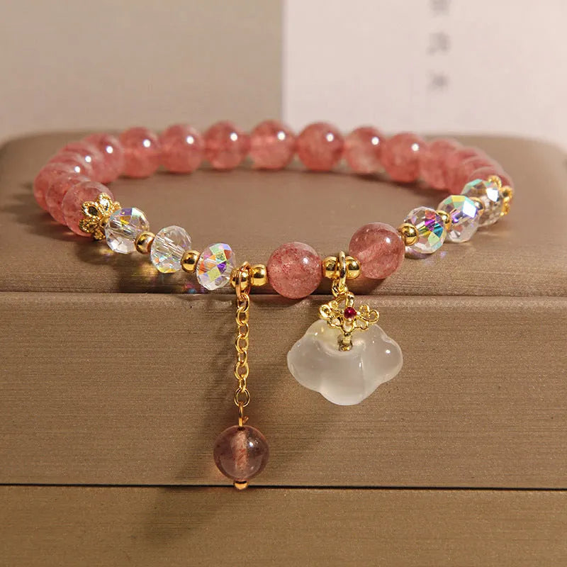 Women's crystal bracelet with strawberry quartz beads and white agate auspicious clouds design