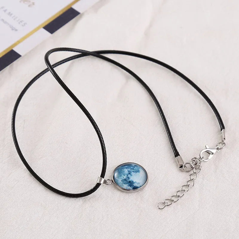 Luminous alloy necklace with a glass Christmas night sky constellation pendant and an extension chain.