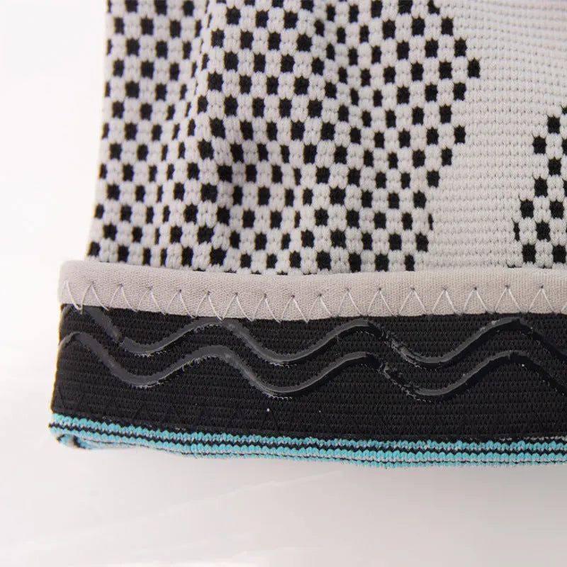 Sky blue silicone knee pad for basketball and sports on a knee.