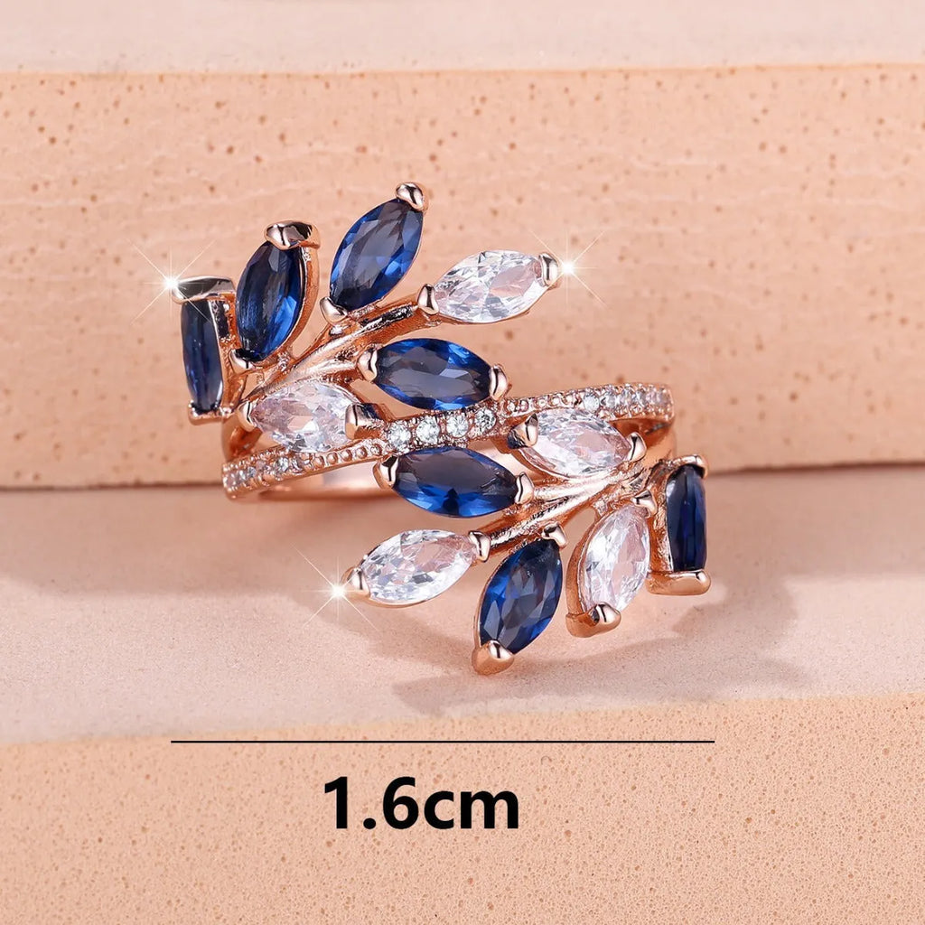 Adjustable copper leaf ring with zircon stones in multiple colour options including sapphire blue and white diamond