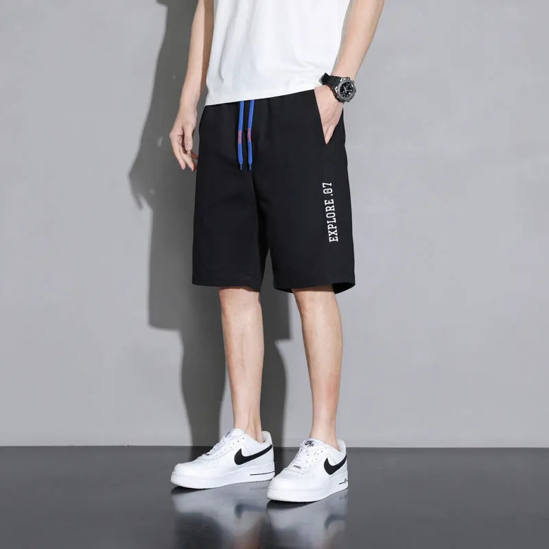 Cotton shorts for boys in black, khaki, or white, showing mid-waist and shorts-length design.