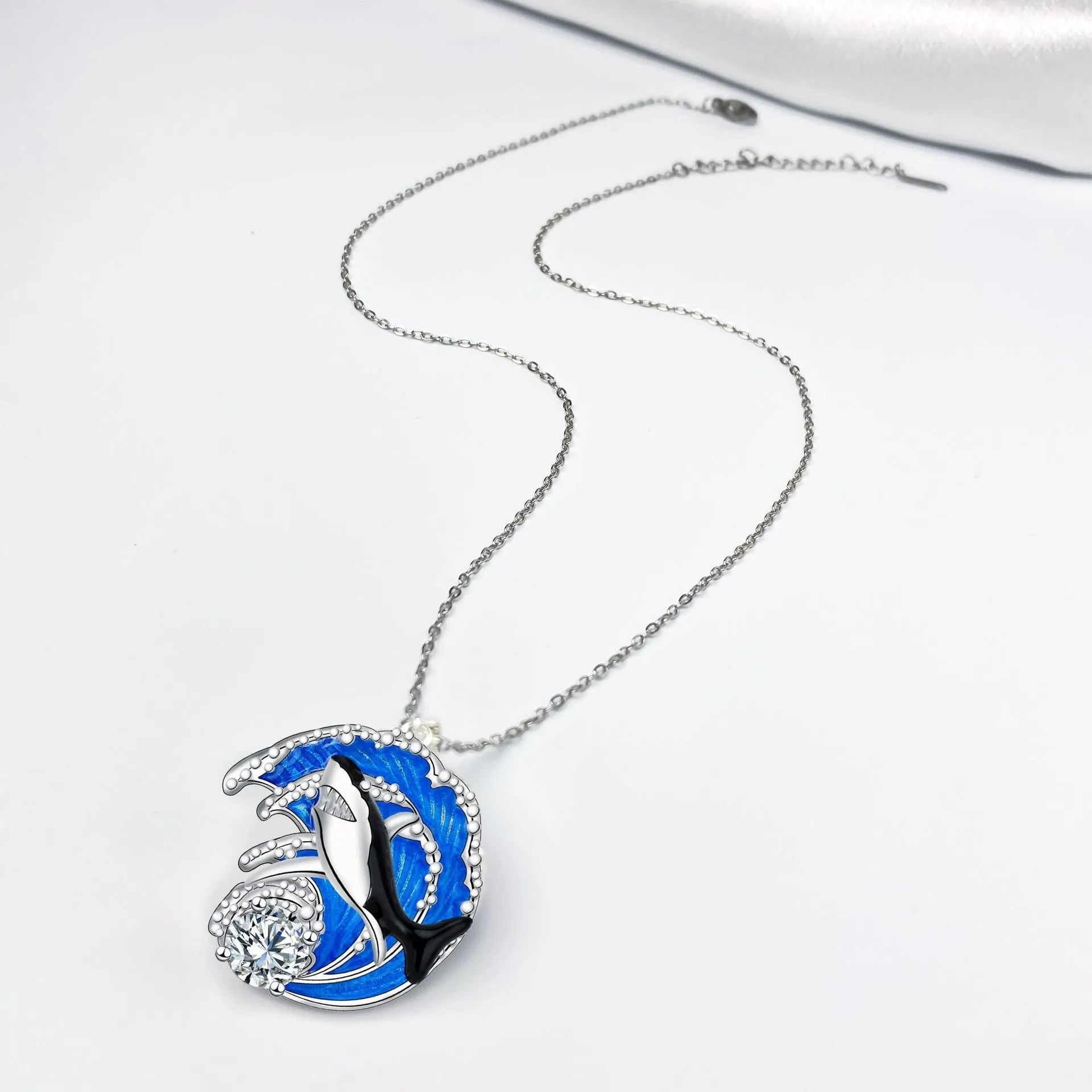HAILANG women's silver-tone shark pendant necklace on an adjustable cross chain.