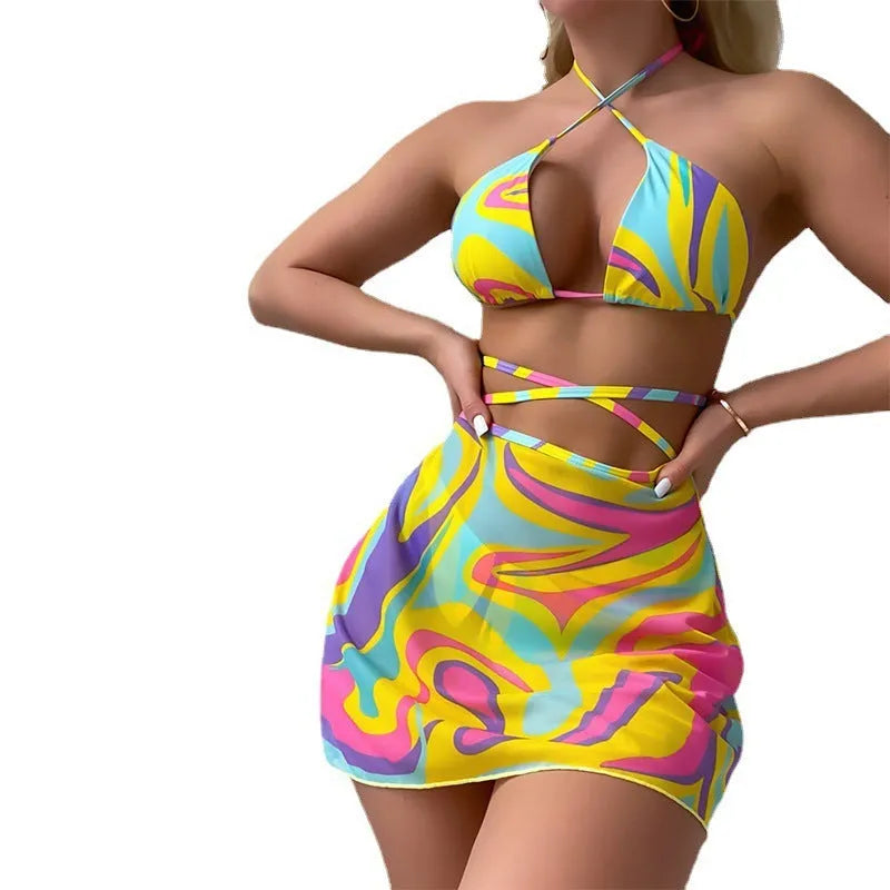 Yellow striped halter-neck swimsuit with lace-up front, includes matching skirt and shorts