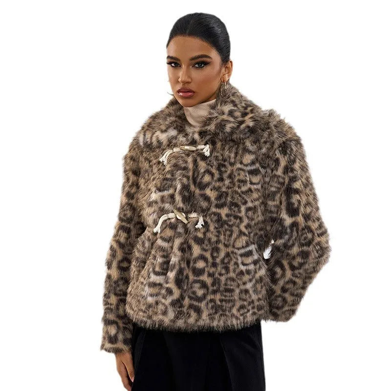 Women's leopard print street fashion coat with a buckle detail on the lapel.