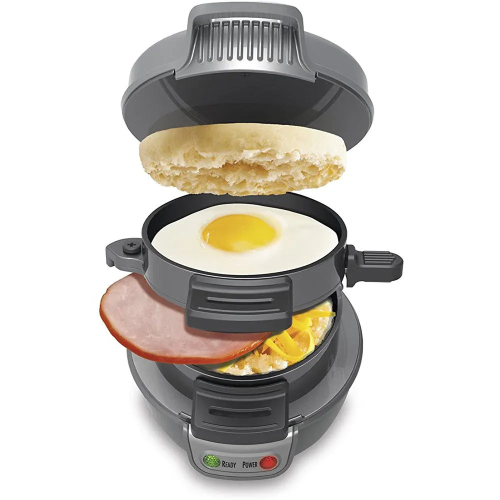 Bright red household breakfast machine with sandwich plates and egg cooking ring on kitchen counter