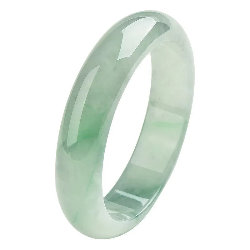 Light green jade bracelet in natural style showing simple closed-loop design