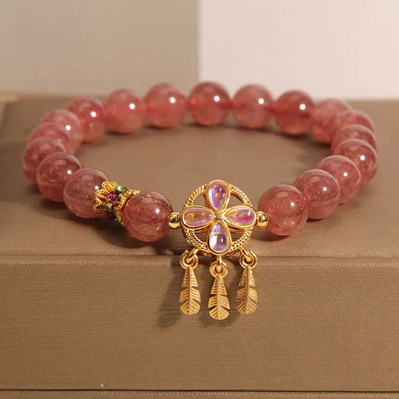 Women's strawberry quartz crystal bracelet with four-leaf dream catcher ball pendant