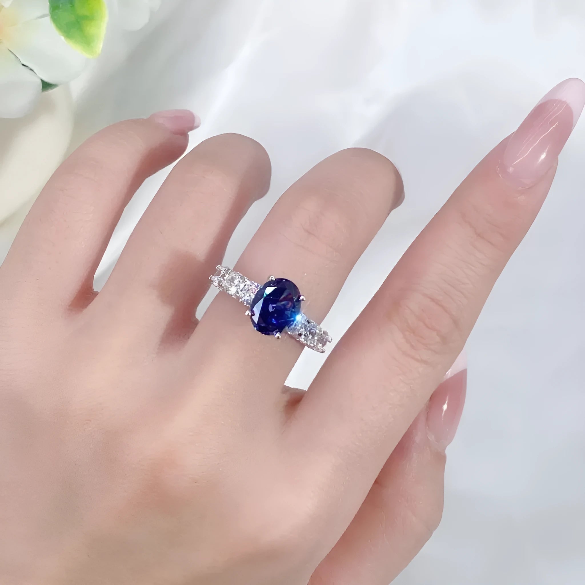 Heart-shaped sterling silver ring with a faceted ice flower cut zircon stone in a Tanzanite colour.