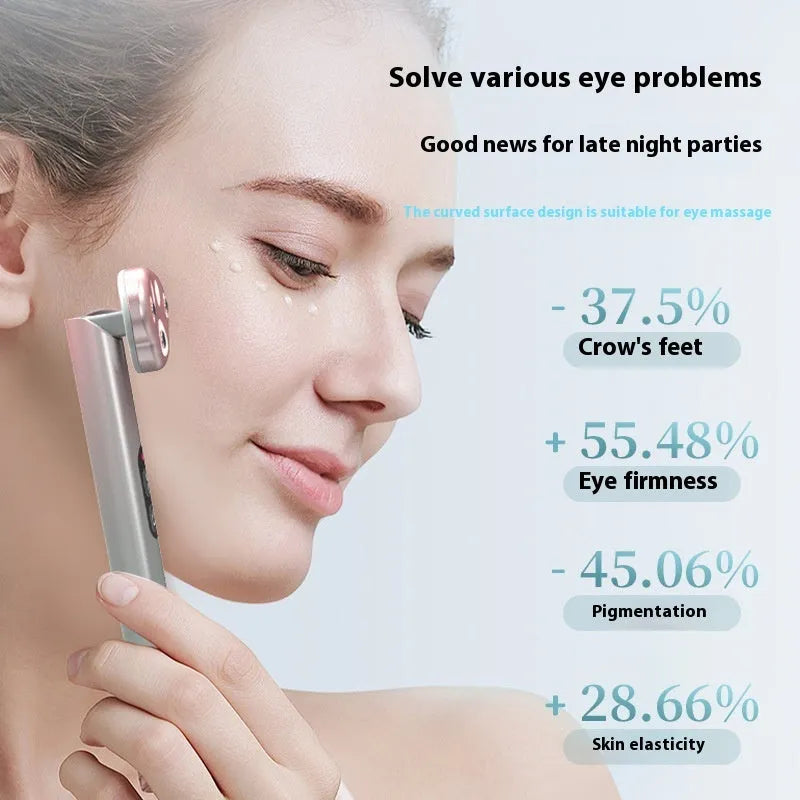 Cat's paw shaped micro-current eye massager in gradient pink with charging cable