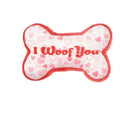 A PP plastic plush pet chew toy in one of four colours: bone powder, bone white, peach heart pink, or peach heart red.