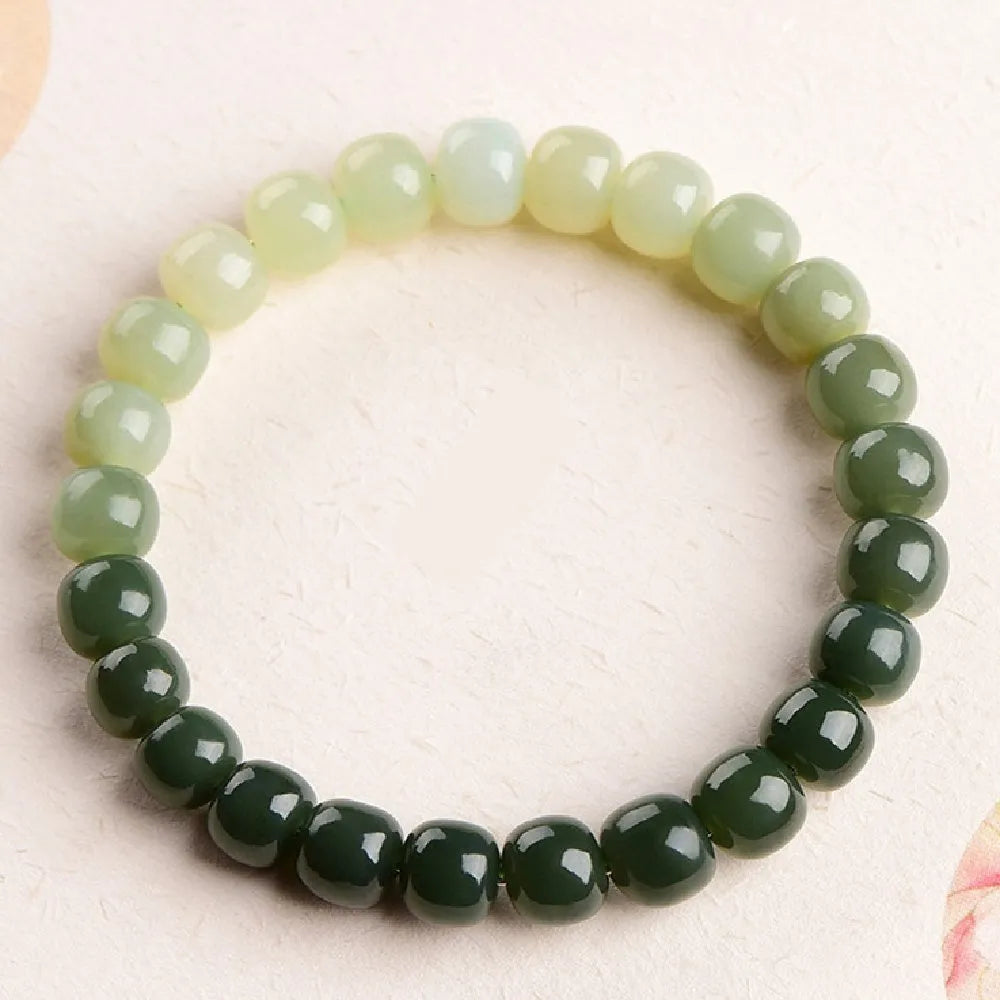 Natural Hetian jade bracelet with water gradient colour beads in two size options.