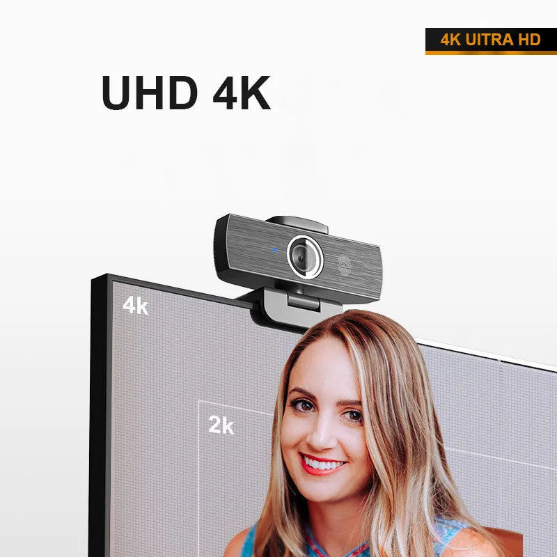 Black USB webcam on a desk with a detached magnetic privacy cover and a 1.7-metre cable