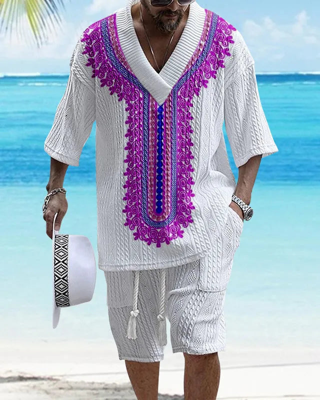 Man wearing a printed drop-shoulder knitted short-sleeve top with matching shorts in a casual setting.