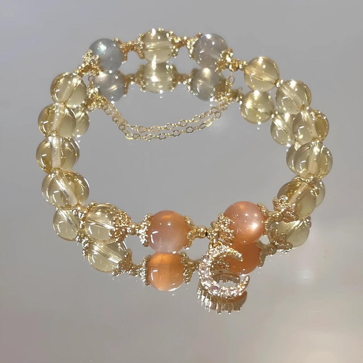 Chinese style women's crystal bracelet with 14K gilded moonstone, golden sun stone, and citrine colour diamond-shaped elements