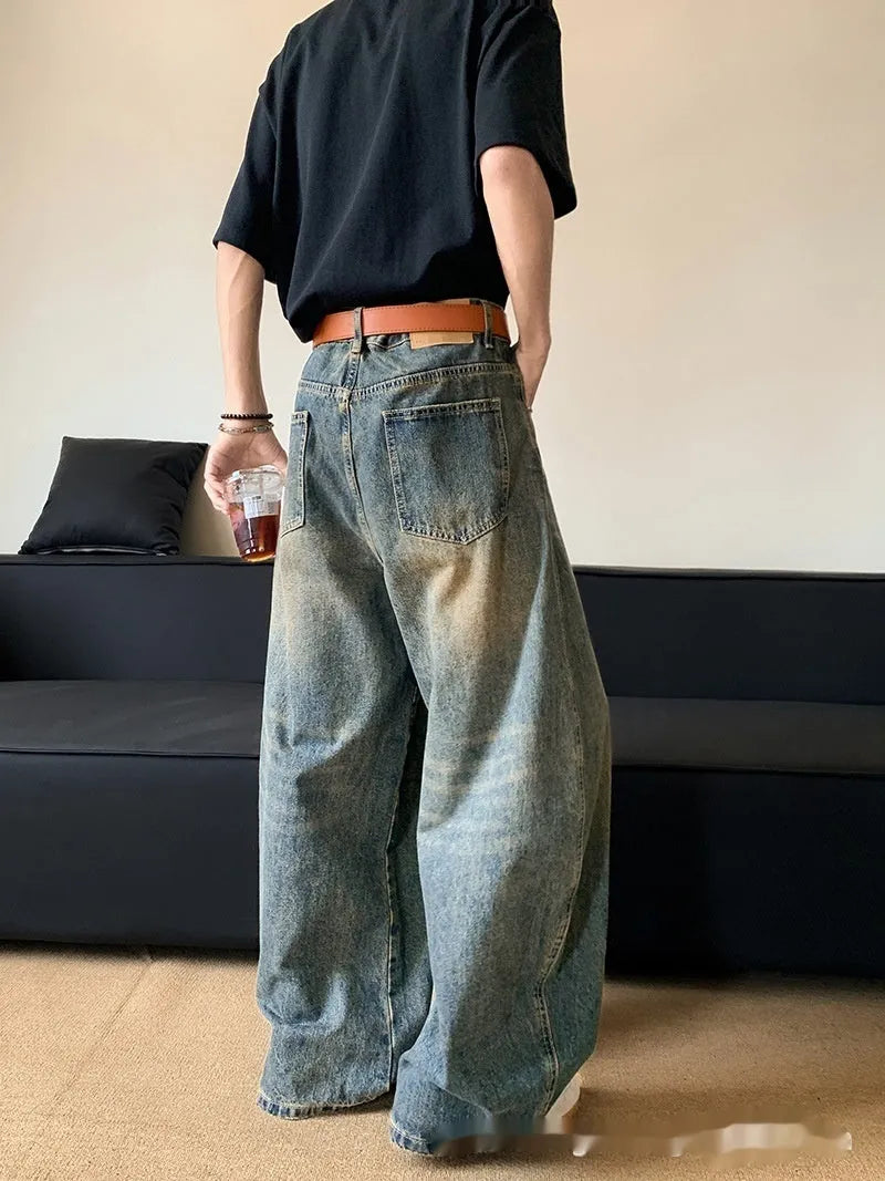 Men's retro blue distressed denim pants with wide leg cut and micro elasticity fabric