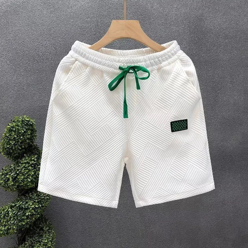 Casual polyester sports shorts with micro-elastic stretch in white, black, or green colours