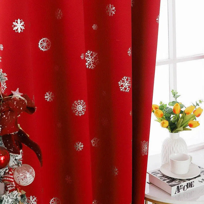 Red polyester snowflake pattern shade cloth curtain with lace loops hanging in modern interior setting
