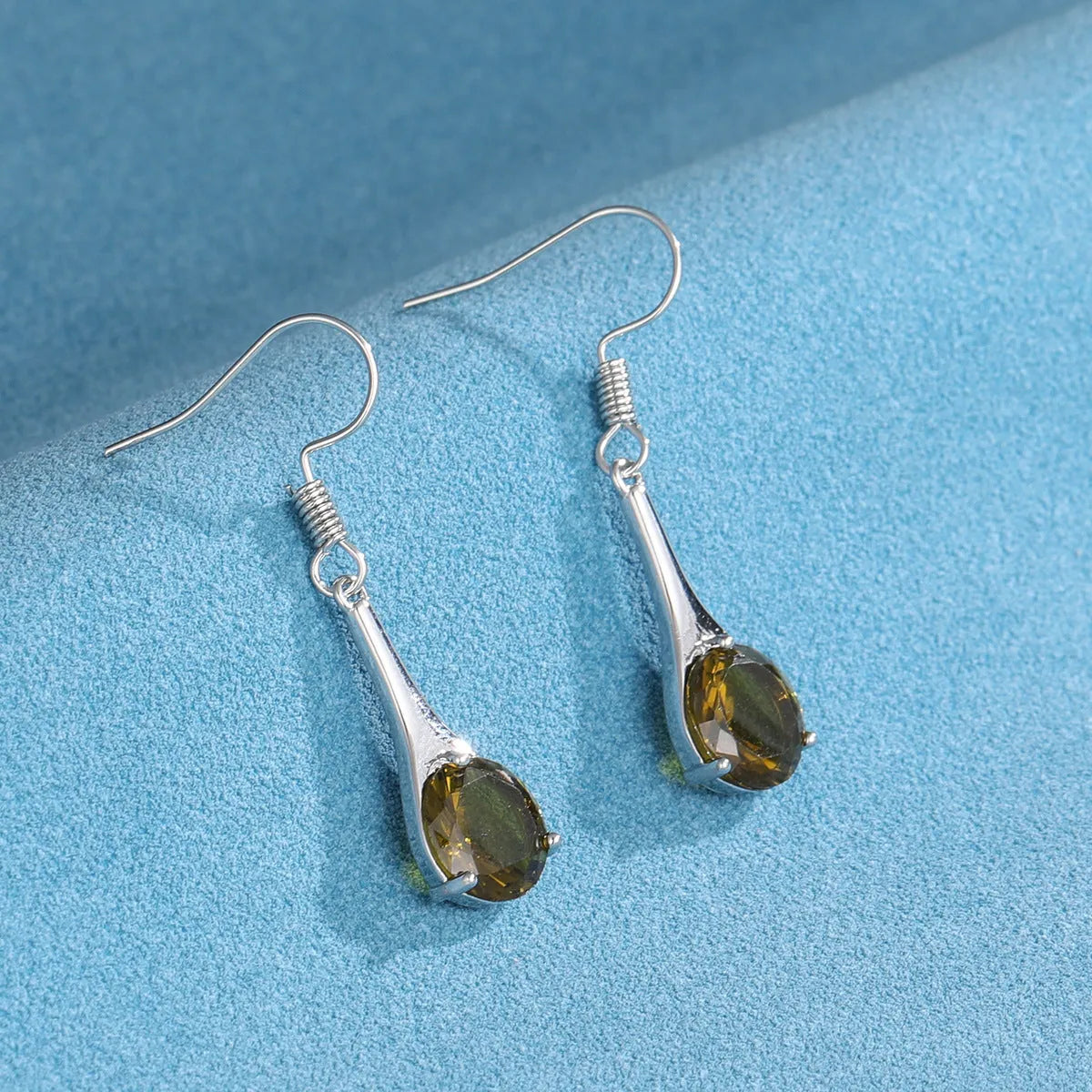 Olive green topaz water drop shaped earrings with minimalist retro design