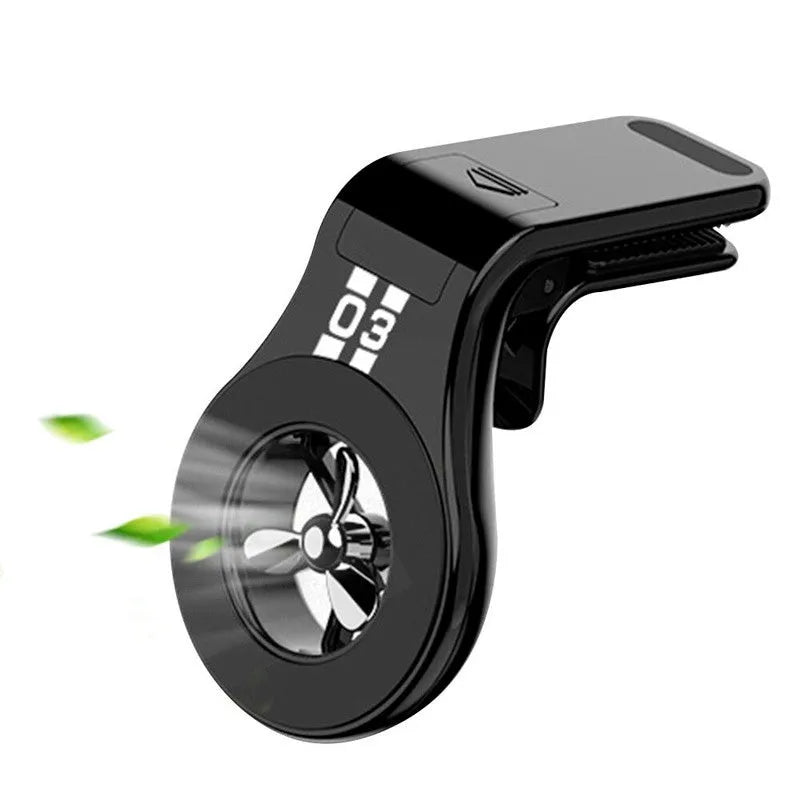 Black magnetic car phone holder attached to a car air vent, holding a smartphone at an angle.