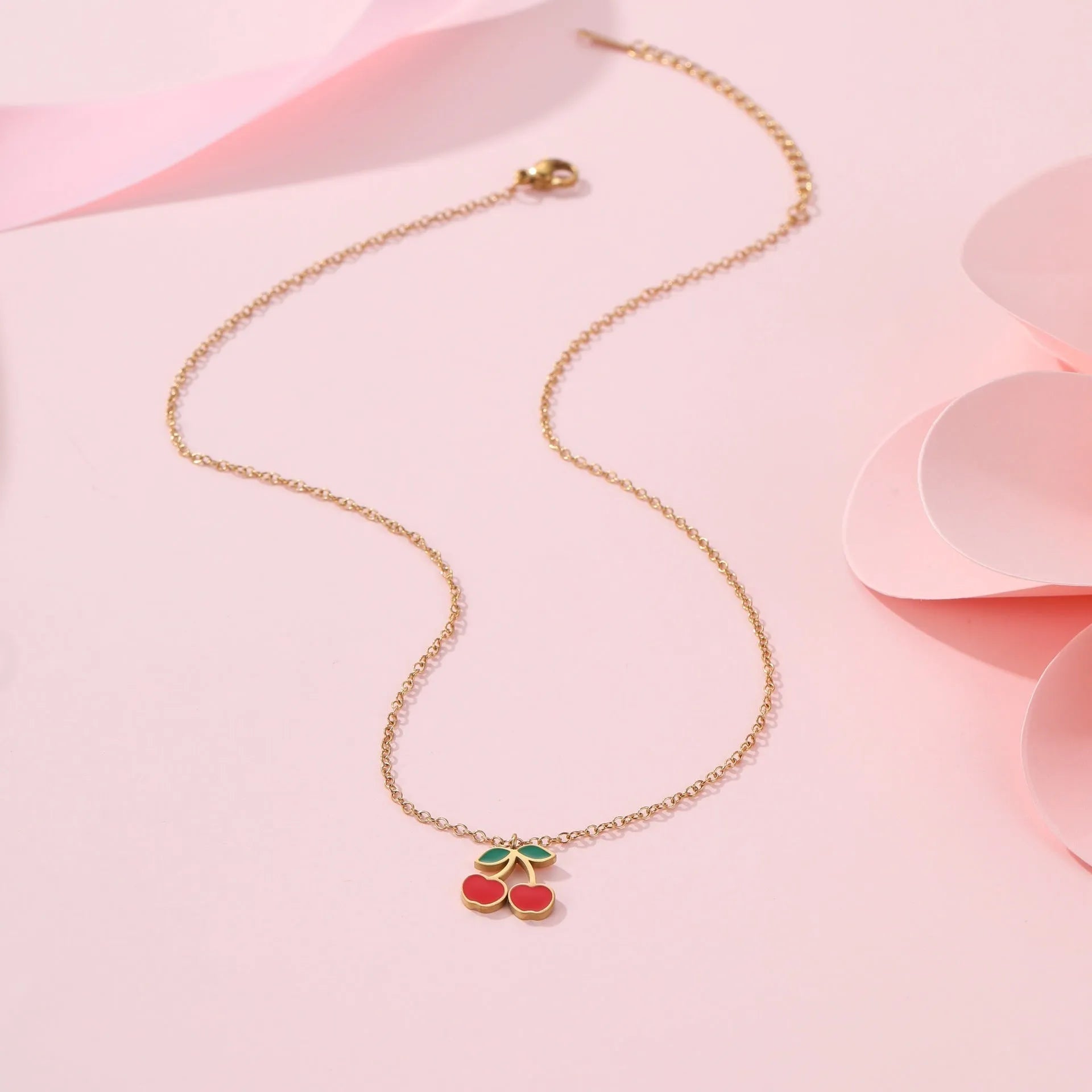 Cherry jewellery set with gold-plated necklace, bracelet, earrings, and ring on stainless steel chain