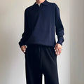 Man wearing a milky white pure wool lapel collar polo sweater with loose fit