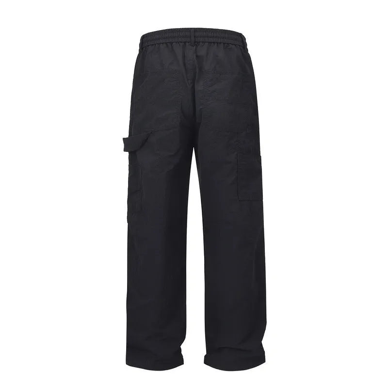 Black tooling paratrooper trousers with three-dimensional cutting and drawstring waist closure